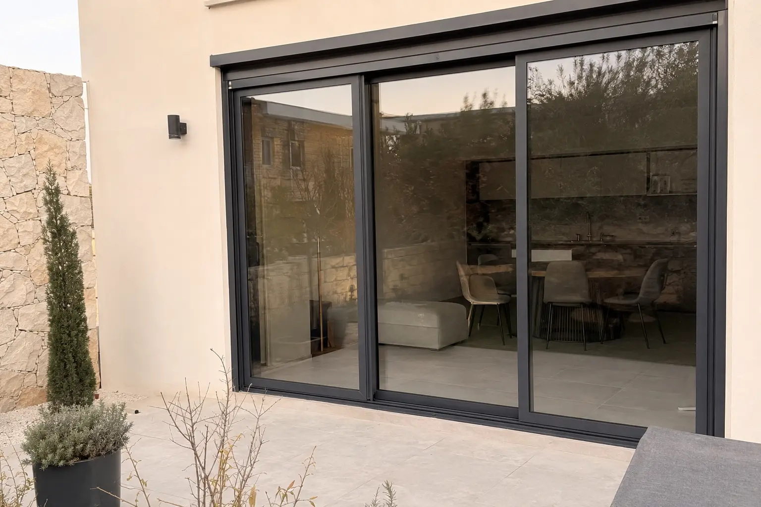 Charcoal aluminium sliding doors on a residential patio